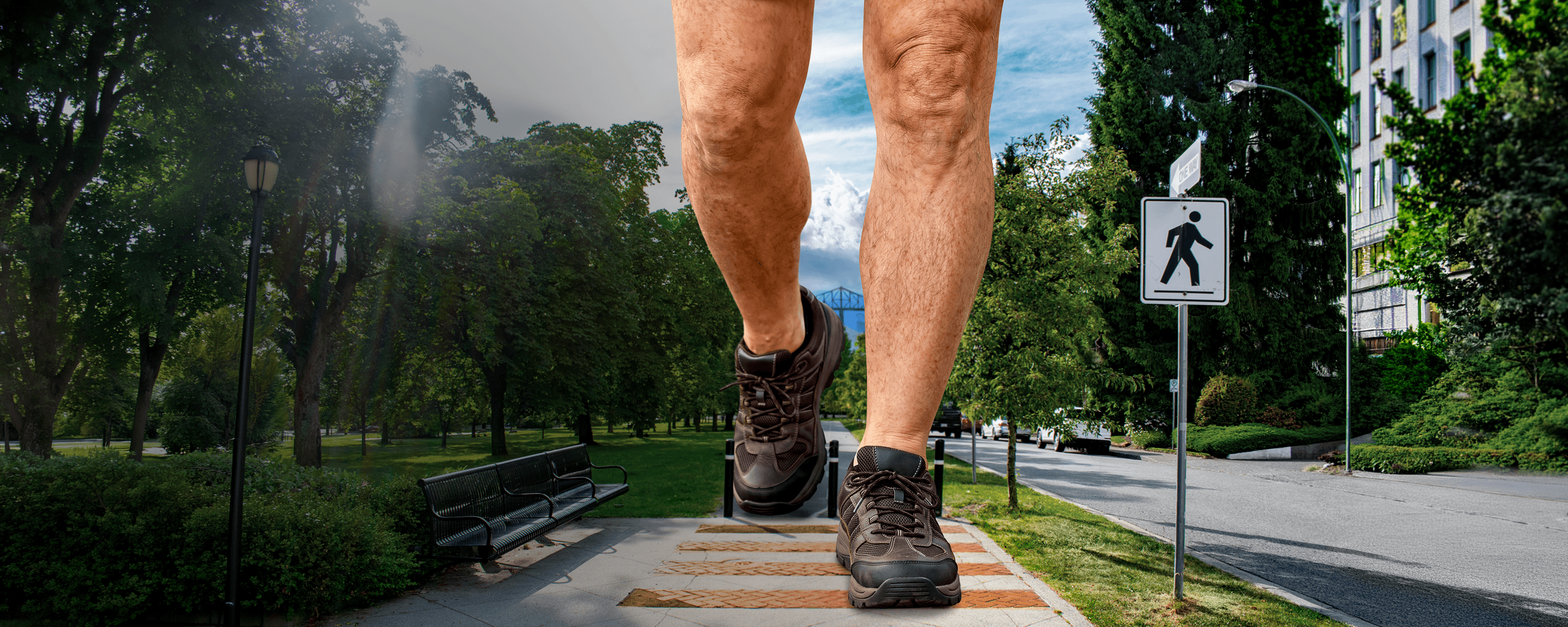 A disproportionately large pair of men's legs, visible from mid-thigh down, walking down a sidewalk.